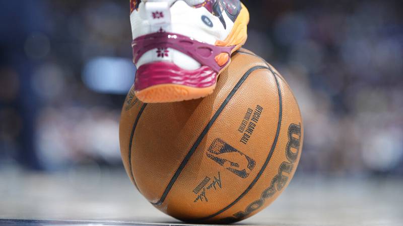 Atlanta Hawks guard Bogdan Bogdanovic (13) places his shoe on the basketball in the second half...