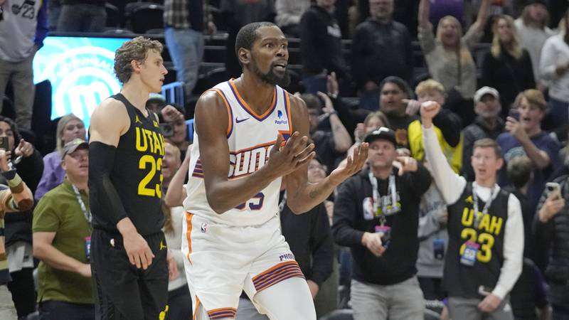 Phoenix Suns forward Kevin Durant (35) reacts after he was initially whistled for a foul on...